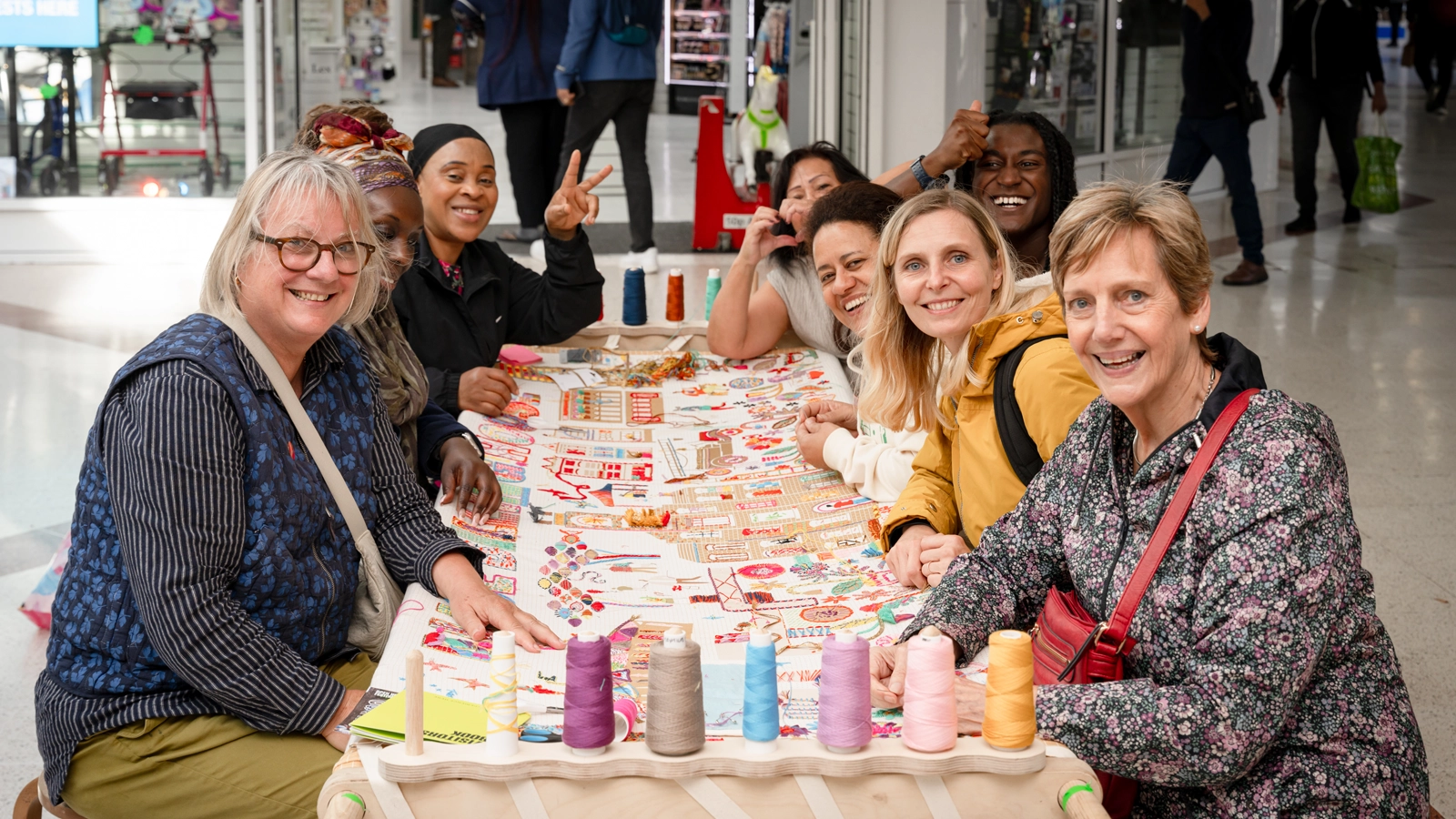 Support inset Community outreach embroidery in a shopping centre