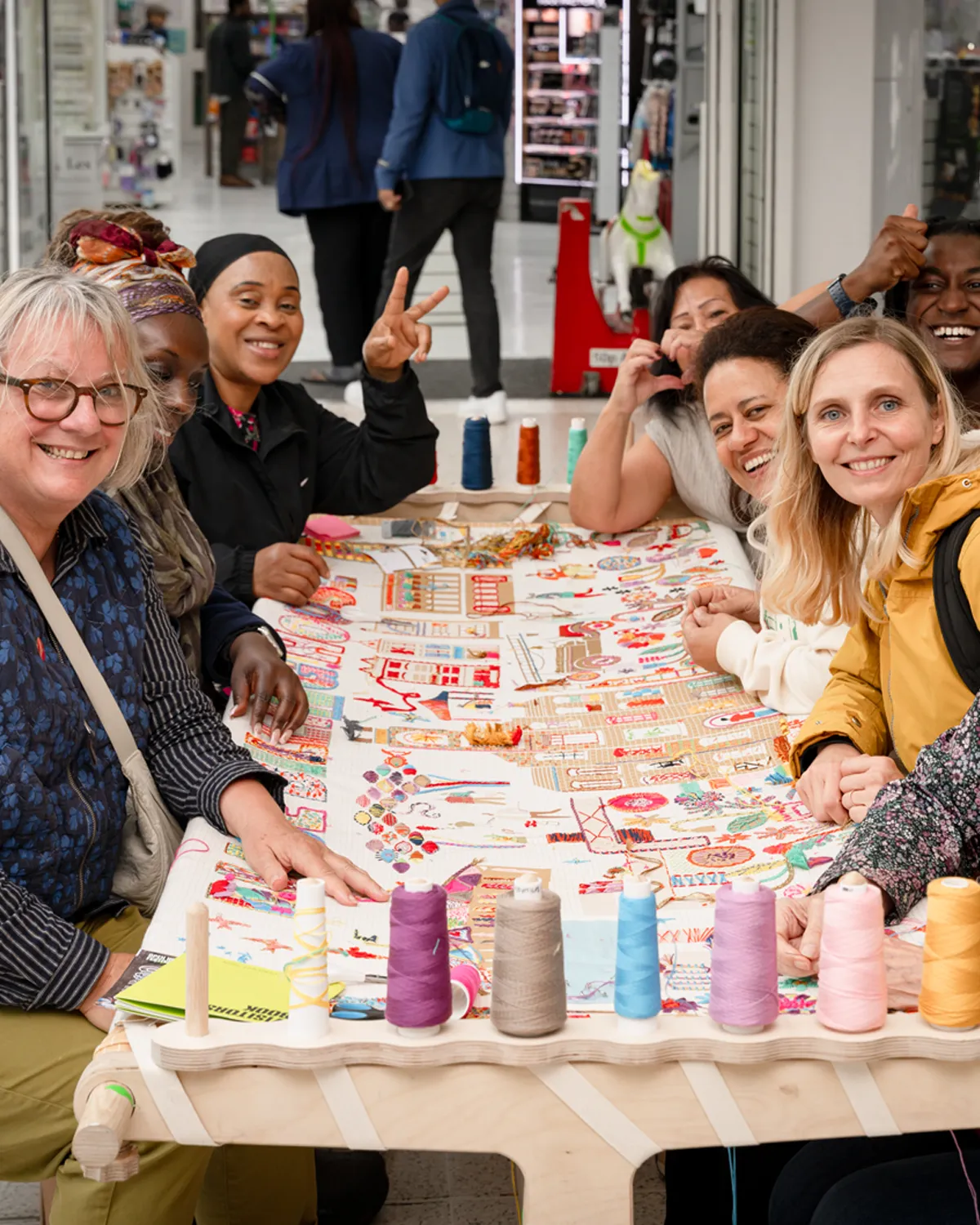 Support inset_Portrait Community outreach embroidery in a shopping centre